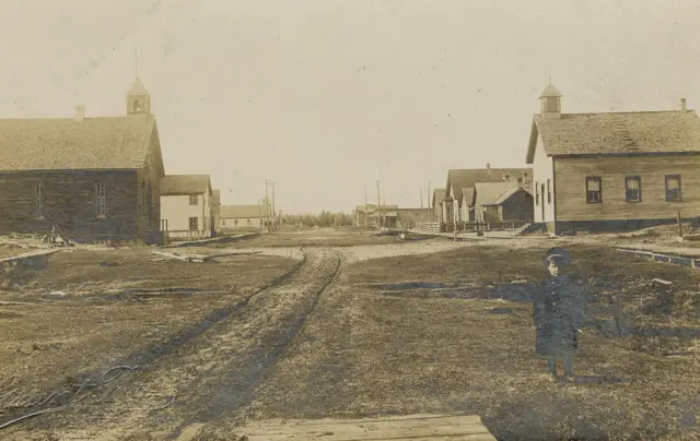 Main street with churches and a child
